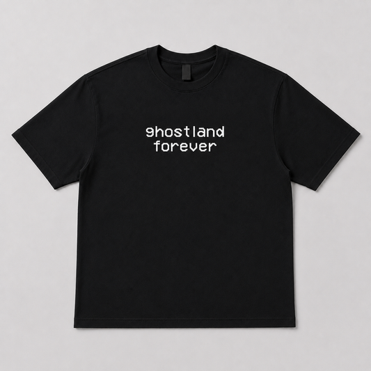 A black short-sleeve crewneck t-shirt with the words 'ghostland forever' printed in white lowercase letters across the chest, displayed flat against a light gray background.