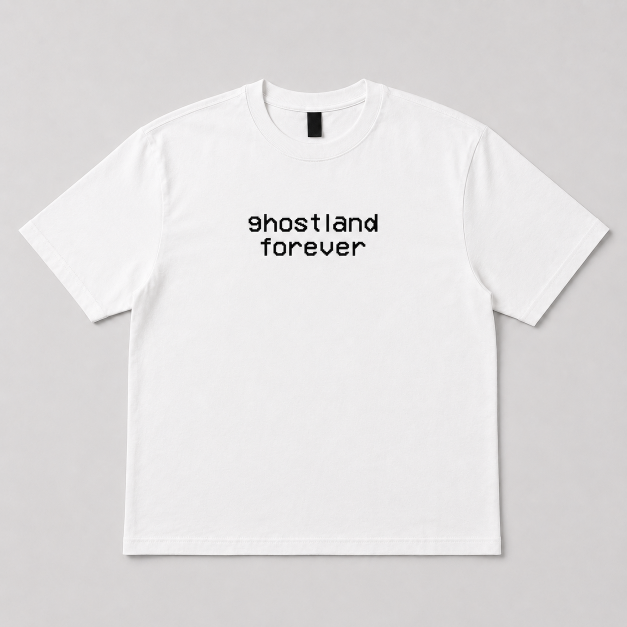 A white short-sleeve crewneck t-shirt with the text 'ghostland forever' printed in black lowercase letters across the chest, displayed flat against a neutral gray background.