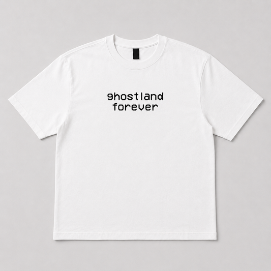 A white short-sleeve crewneck t-shirt with the text 'ghostland forever' printed in black lowercase letters across the chest, displayed flat against a neutral gray background.